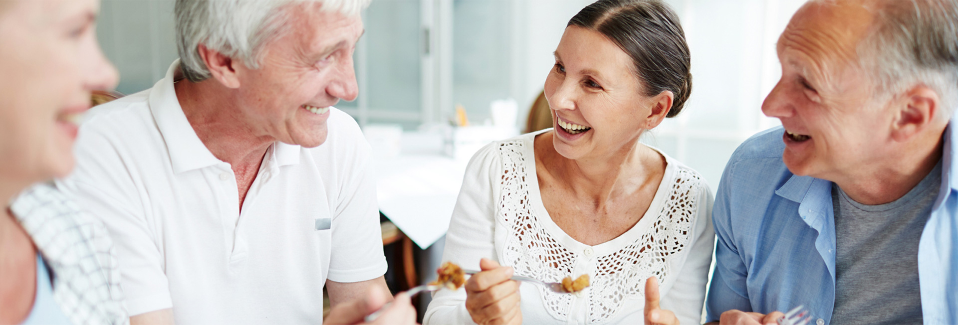 Patient smiling with new implant supported dentures at Horbury Dental & Implant Clinic